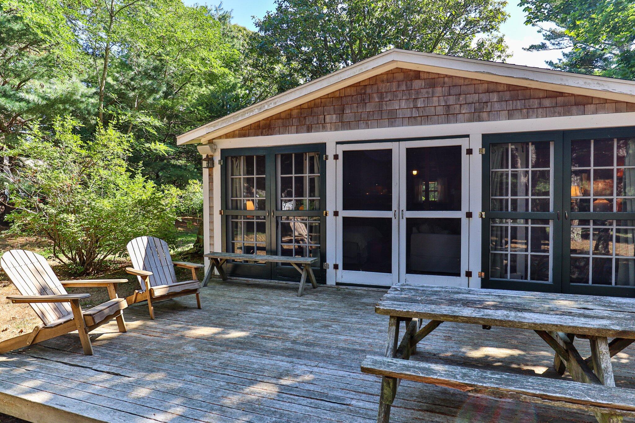 1975 State Highway, Unit 9 Eastham, MA 02642 - Photo 21 of 23 a backyard of a house with seating space