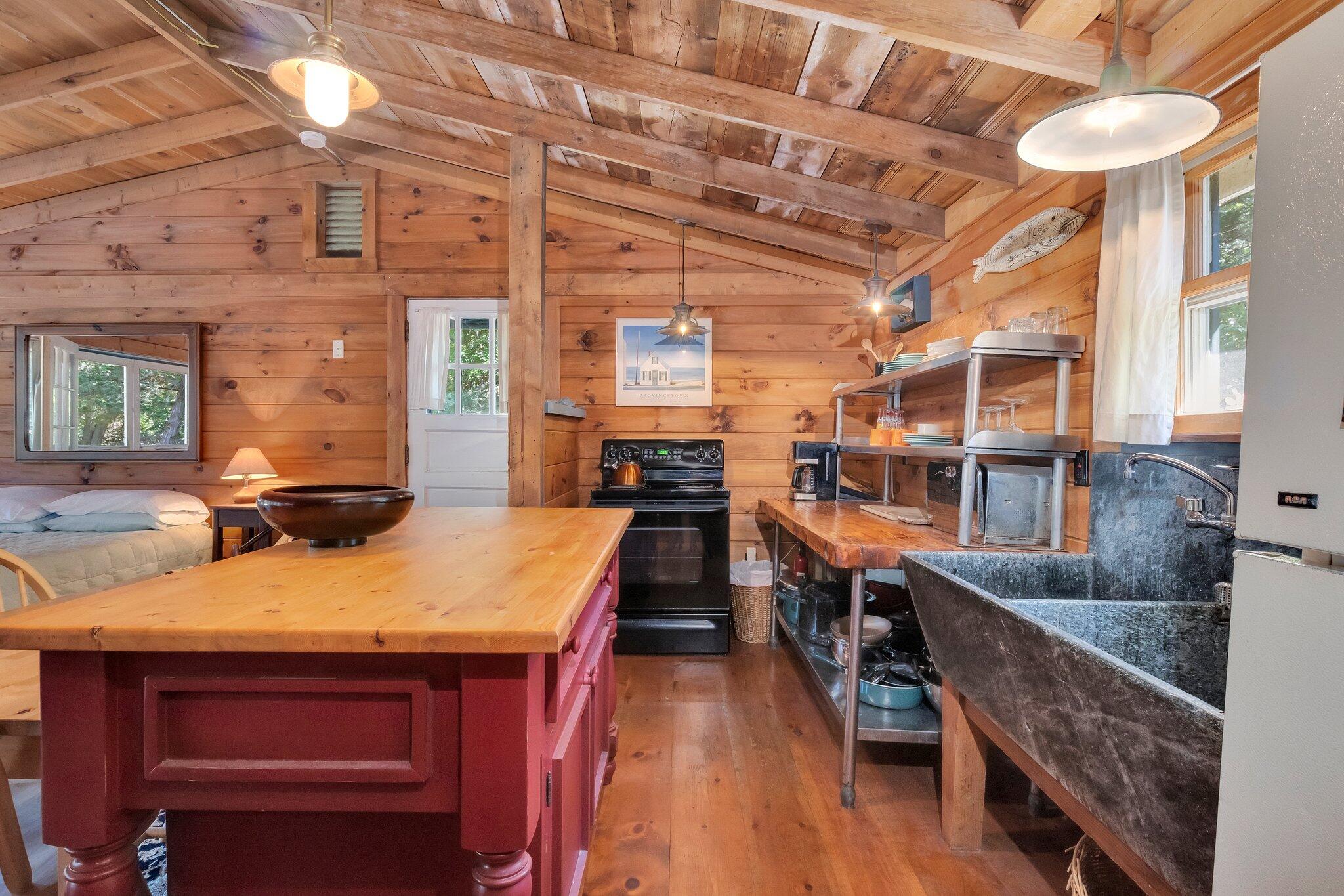 1975 State Highway, Unit 9 Eastham, MA 02642 - Photo 3 of 23 a dining hall with stainless steel appliances kitchen island granite countertop a large kitchen counter top and stove
