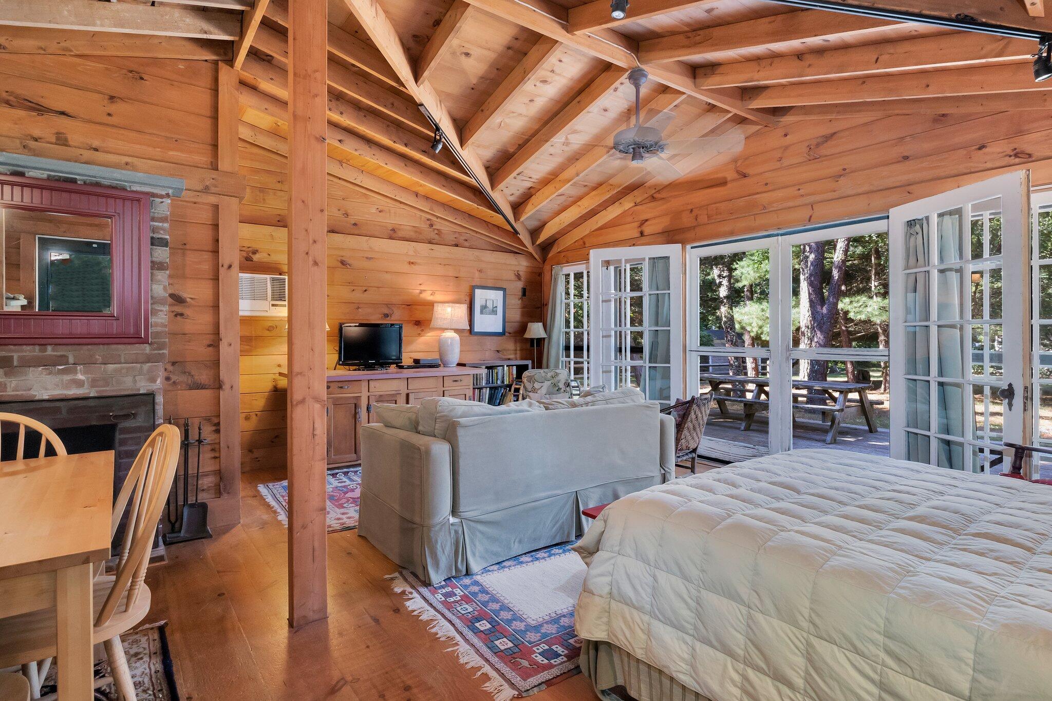 1975 State Highway, Unit 9 Eastham, MA 02642 - Photo 5 of 23 a bedroom with furniture and a large window