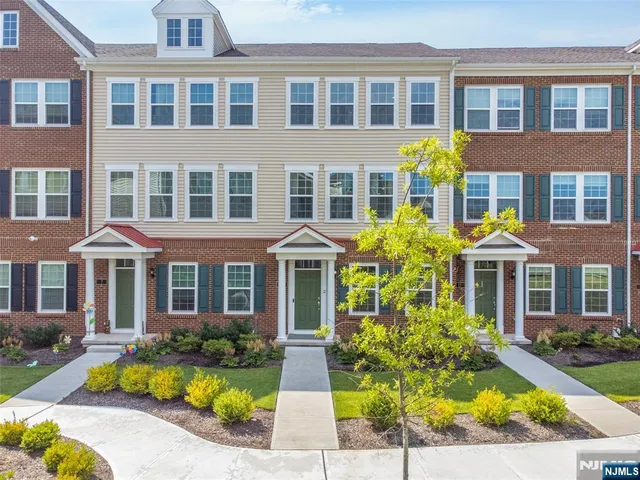a front view of a multi story residential apartment building