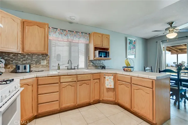 a kitchen with sink cabinets and window