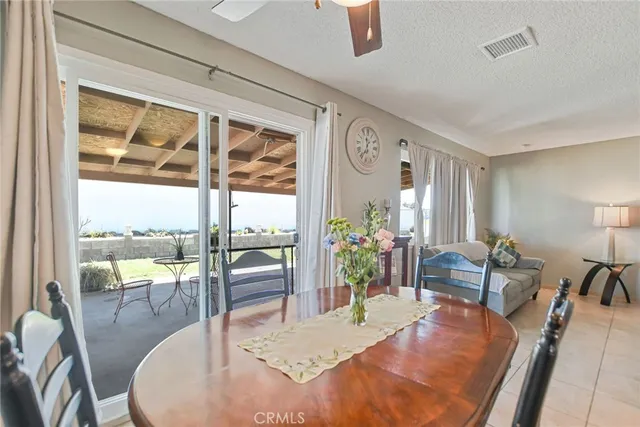 a dining room with table chairs and wooden floor