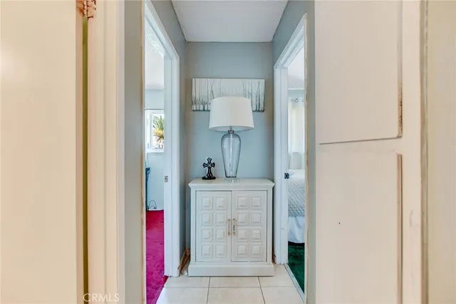 a bedroom with a bed and a table chair