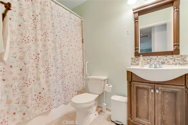 a view of a patio with a table and chairs