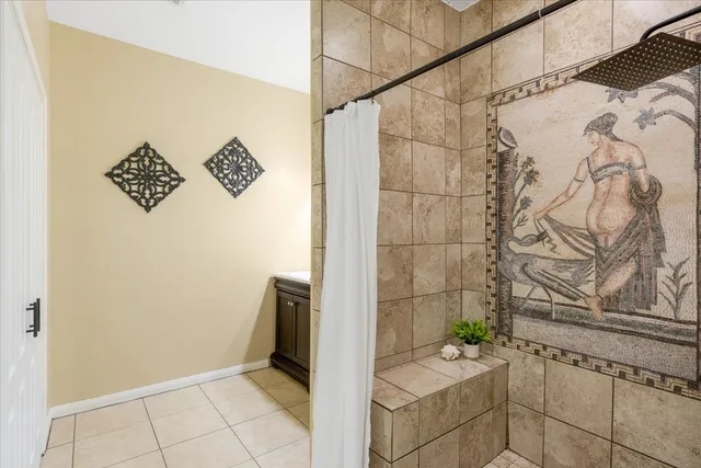 a bathroom with a bathtub and shower