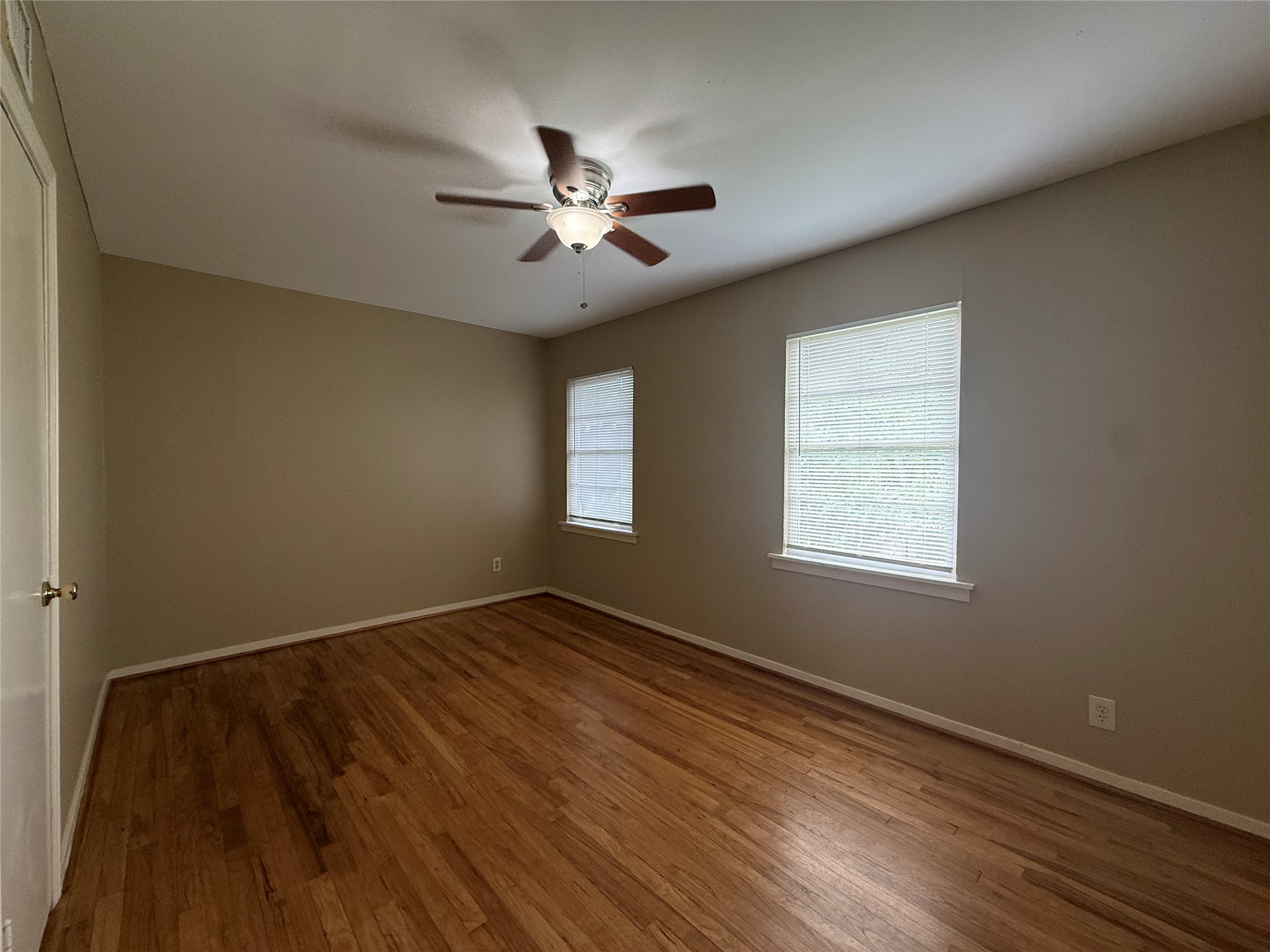 1318 Heights Boulevard, Unit 4 Houston, TX 77008 - Photo 13 of 21 a view of empty room with wooden floor and fan