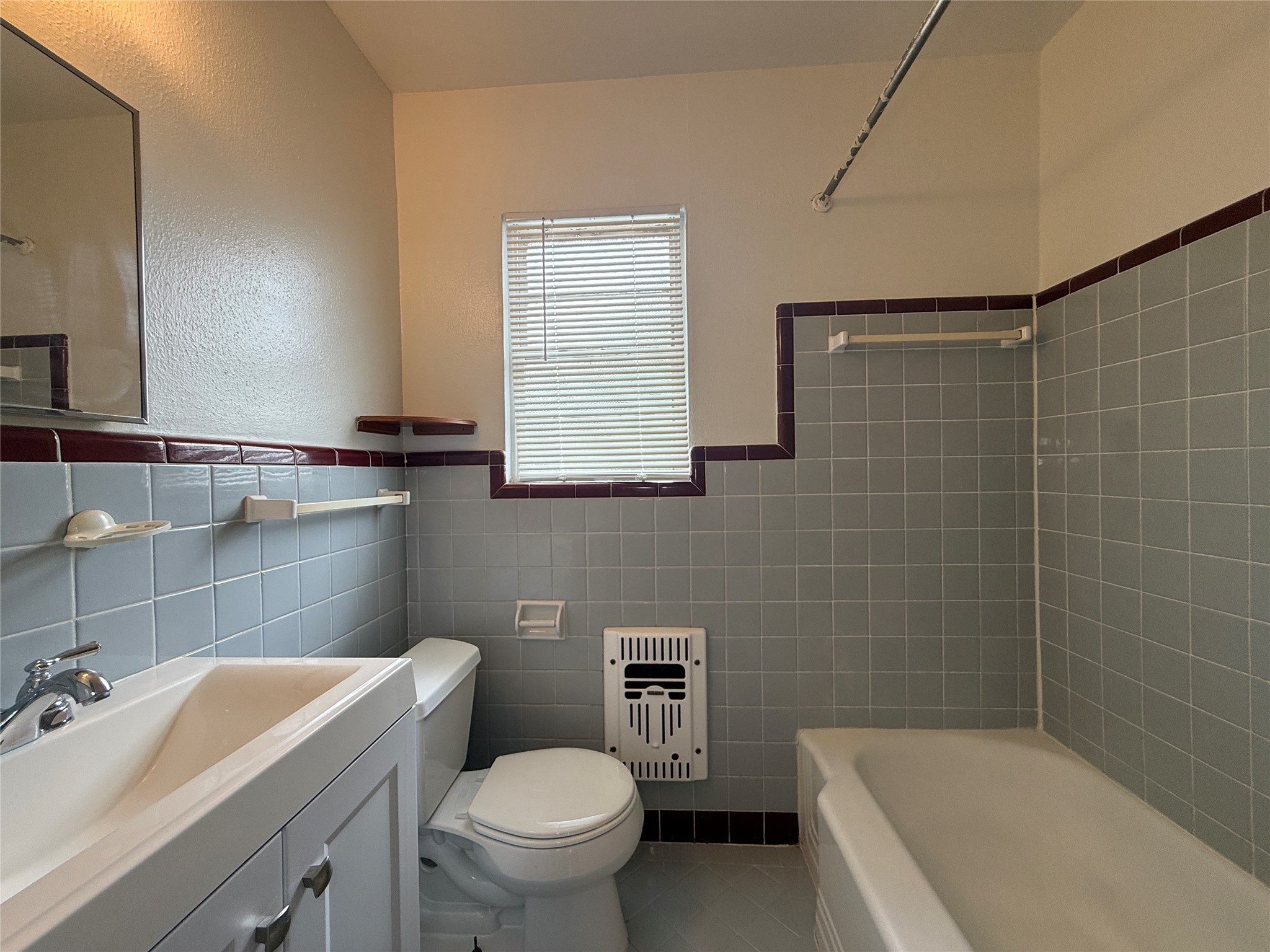 1318 Heights Boulevard, Unit 4 Houston, TX 77008 - Photo 16 of 21 a bathroom with a sink a toilet and shower