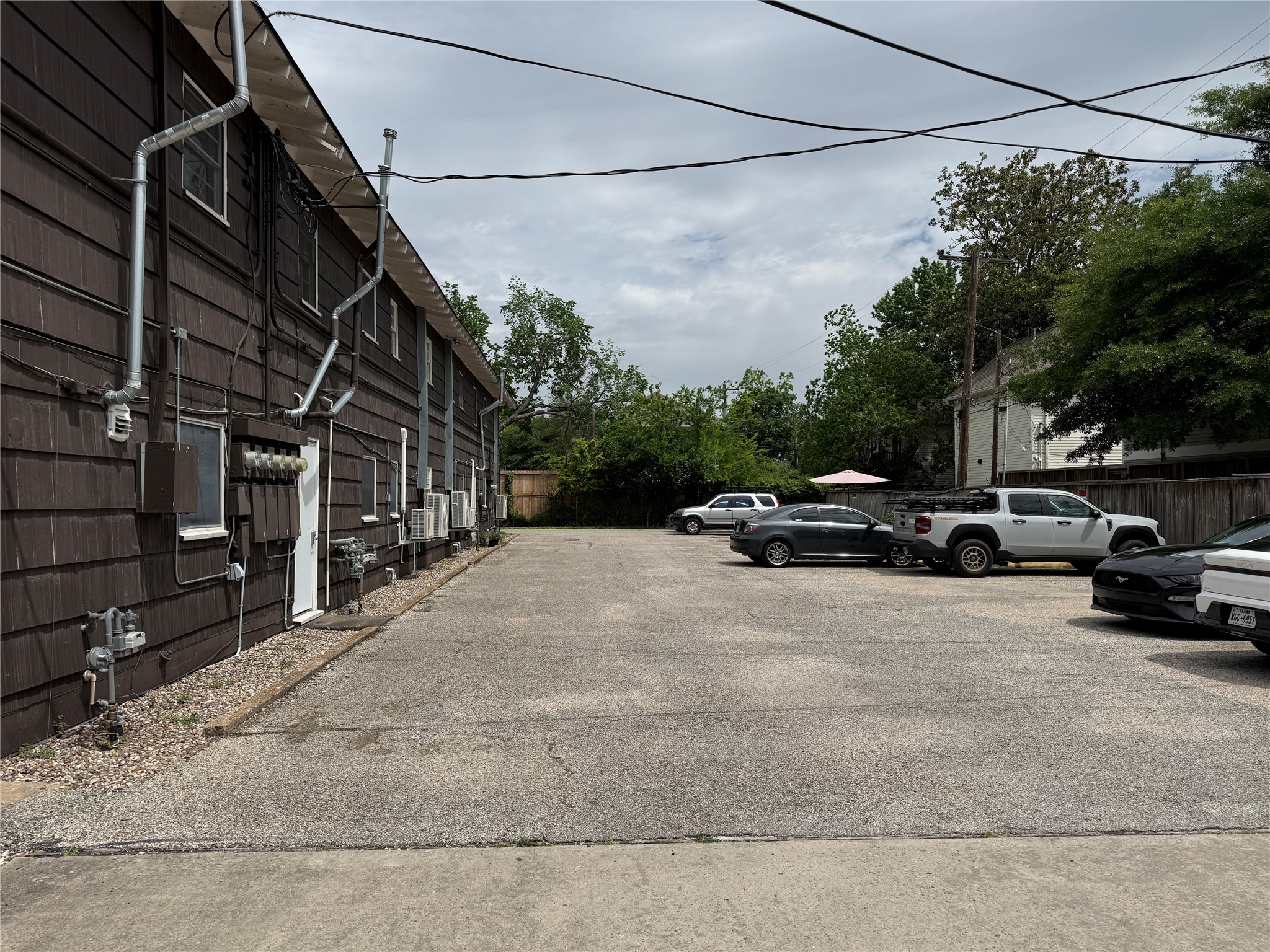 1318 Heights Boulevard, Unit 4 Houston, TX 77008 - Photo 19 of 21 a view of a city street with a car parked on the road