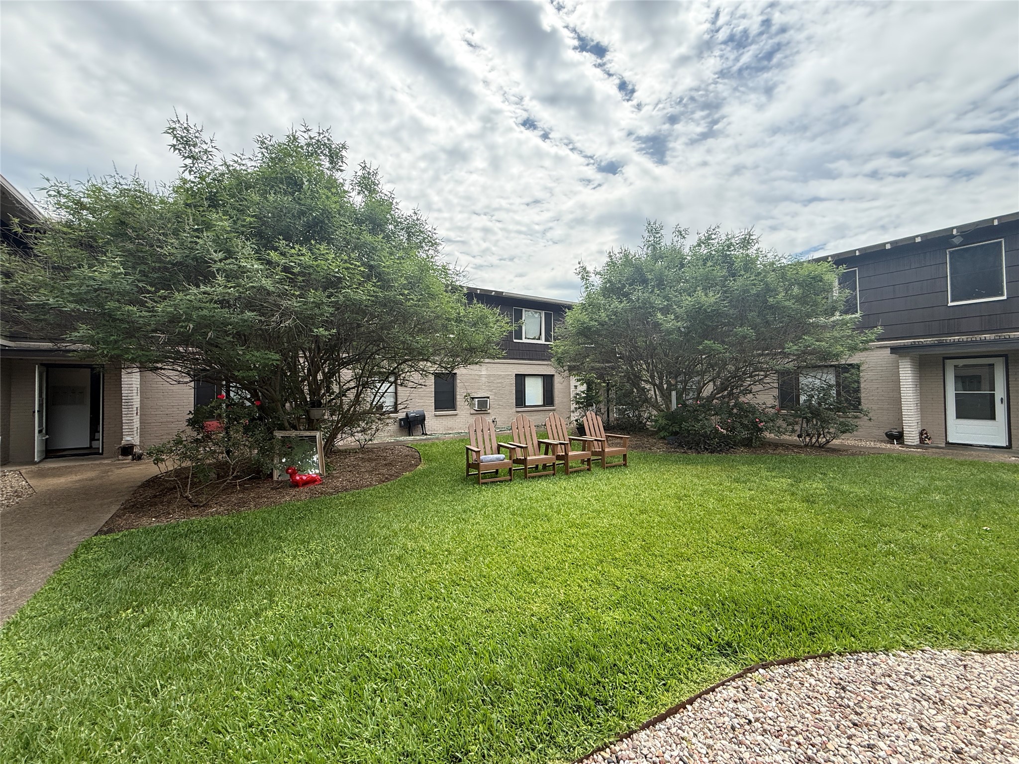 1318 Heights Boulevard, Unit 4 Houston, TX 77008 - Photo 2 of 21 a view of a house with backyard sitting area and garden
