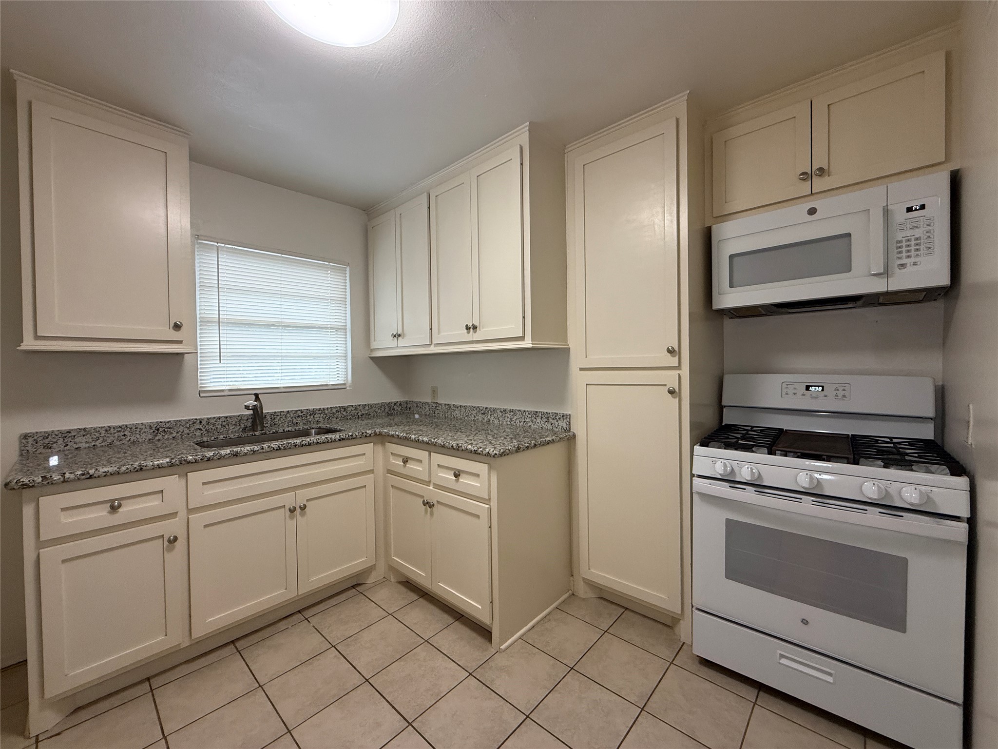 1318 Heights Boulevard, Unit 4 Houston, TX 77008 - Photo 7 of 21 a kitchen with white cabinets and appliances
