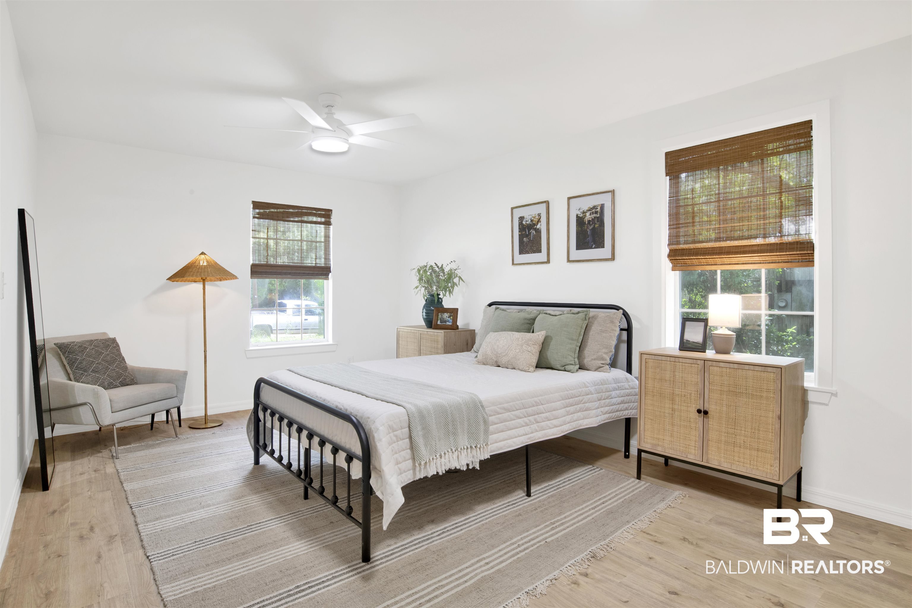 317 Lee Street Chickasaw, AL 36611 - Photo 15 of 40 Primary Bedroom with light wood-type flooring and a ceiling fan