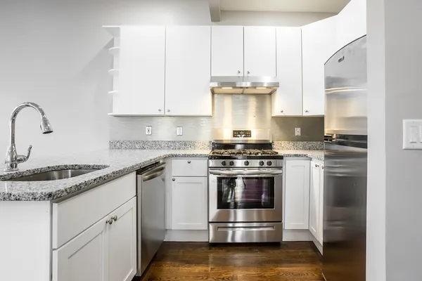 a kitchen with a stove and a sink