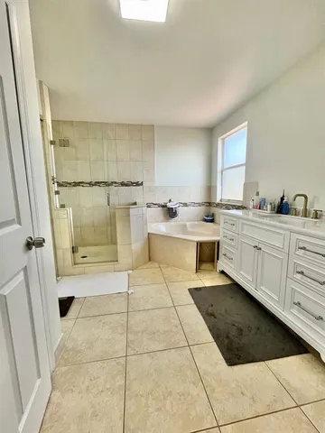 a kitchen with a cabinets a sink and a stove top oven
