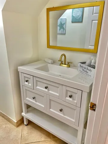 a bathroom with a sink and a mirror
