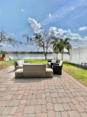 a living room with lots of furniture and a fireplace