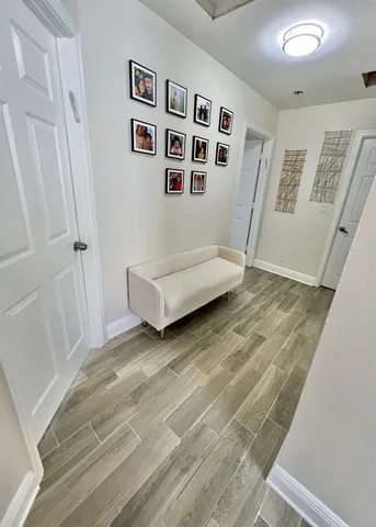 a view of livingroom with hardwood floor and white walls