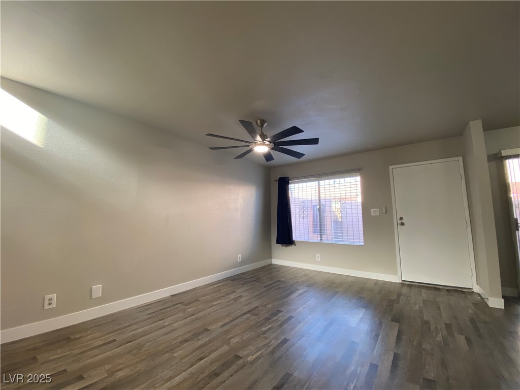 1722 East University Avenue, Unit 8 Las Vegas, NV 89119 - Photo 12 of 28 Spare room featuring dark wood-type flooring and ceiling fan