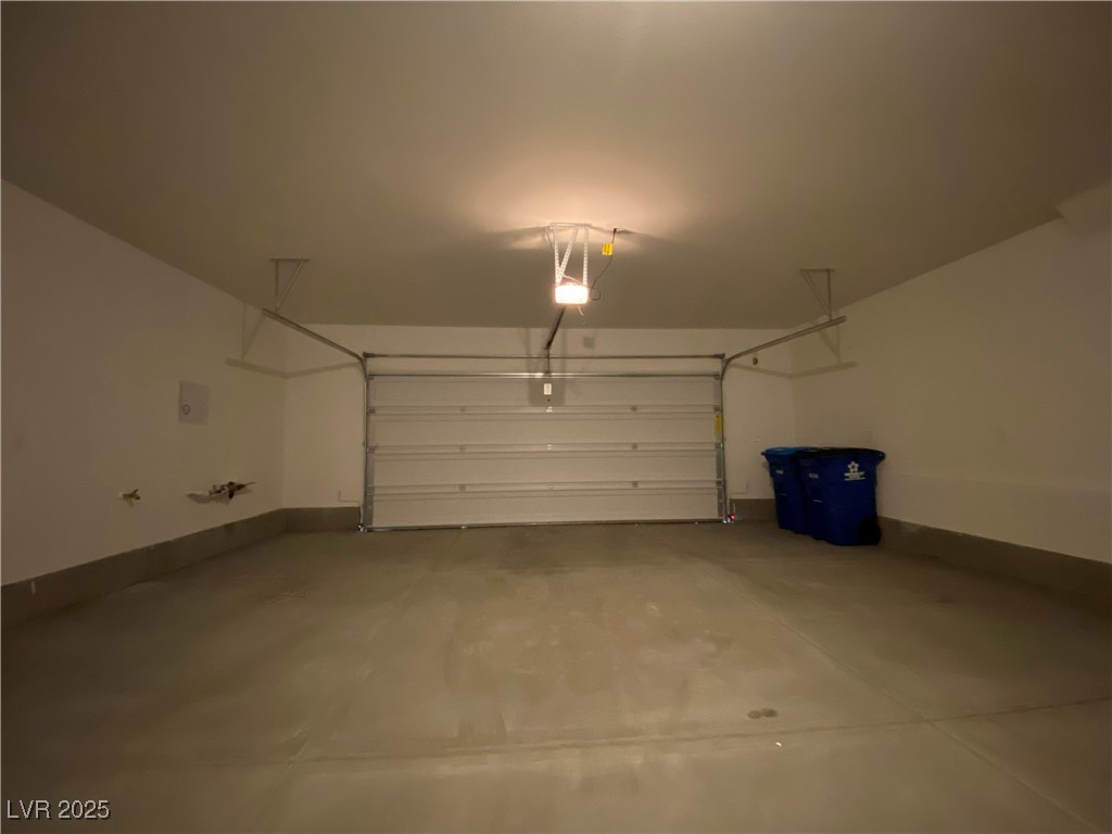 1722 East University Avenue, Unit 8 Las Vegas, NV 89119 - Photo 23 of 28 Garage with baseboards