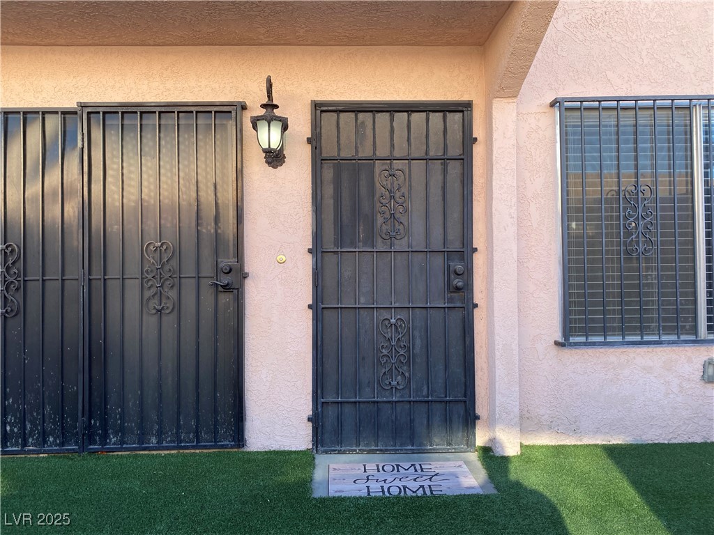 1722 East University Avenue, Unit 8 Las Vegas, NV 89119 - Photo 3 of 28 Entrance to property with stucco siding