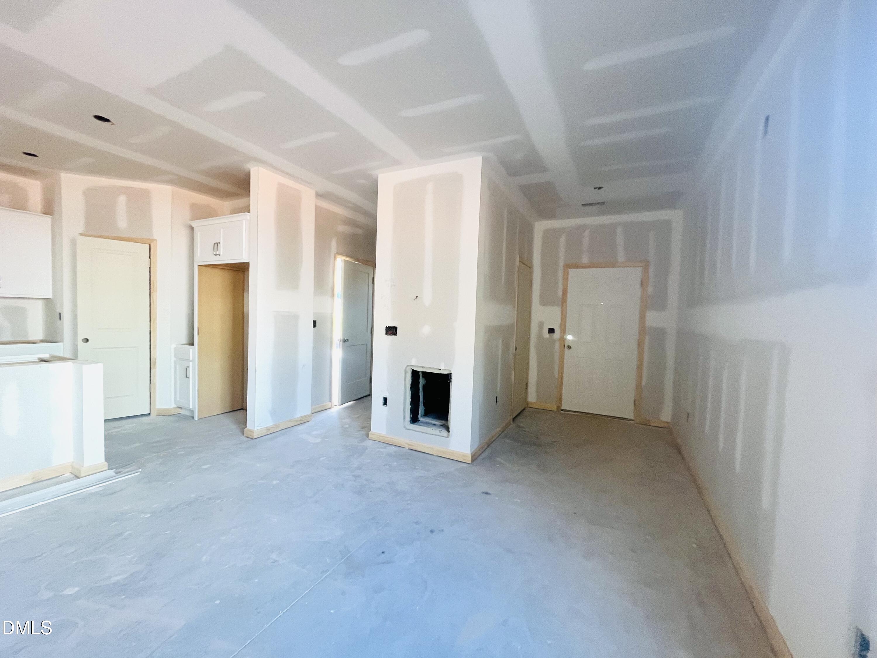 11695 Salers Loop Middlesex, NC 27557 - Photo 17 of 29 a view of a livingroom with kitchen space and windows