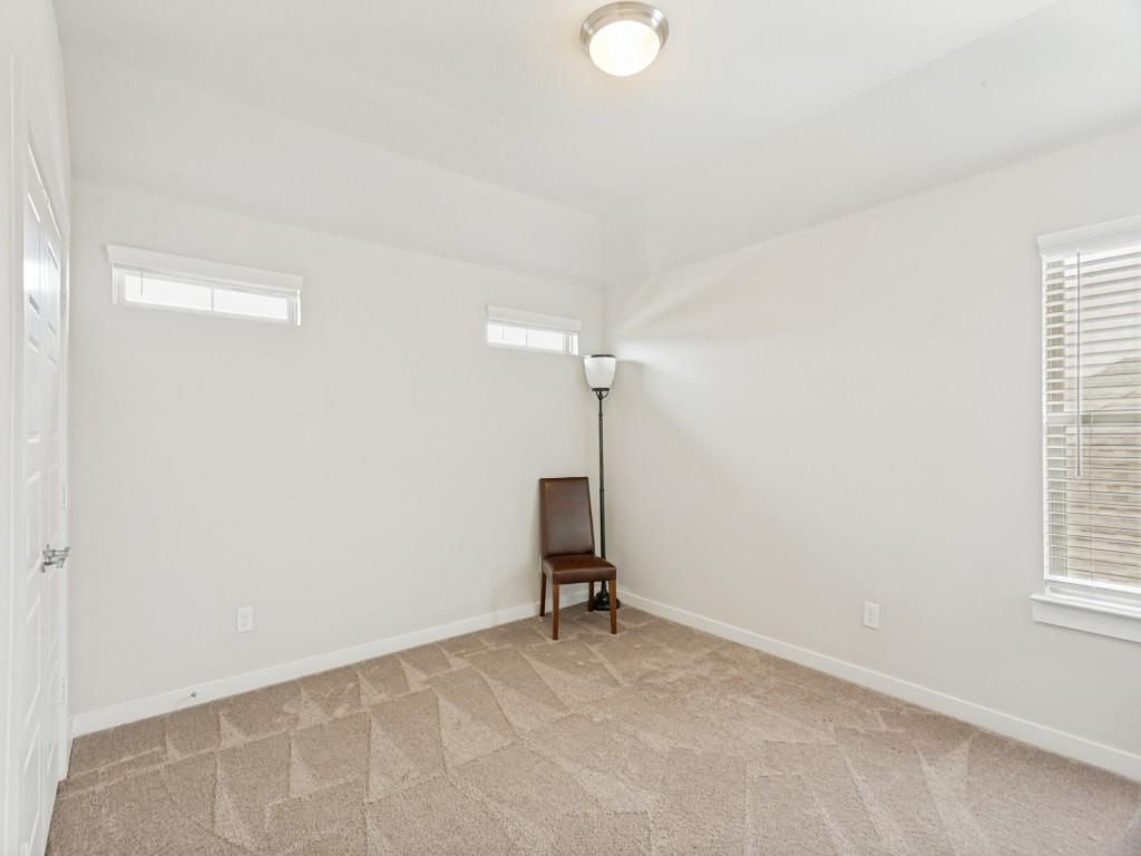 10613 Smiths Bnd Road Fort Worth, TX 76126 - Photo 21 of 29 Carpeted room featuring white walls, a single window with blinds, and transom windows