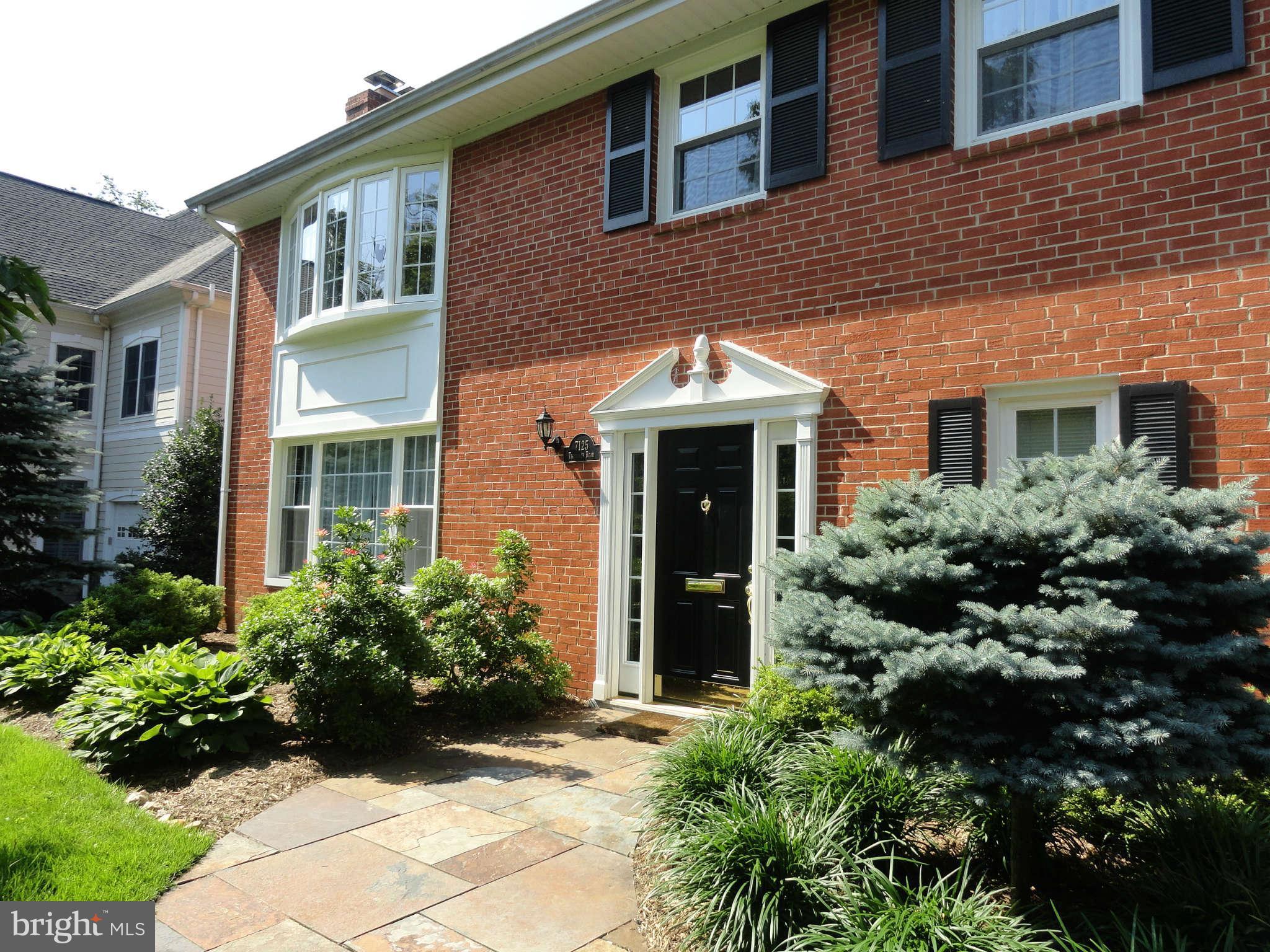 7125 Thrasher Road McLean, VA 22101 - Photo 2 of 27 Curved multi color stone walkway