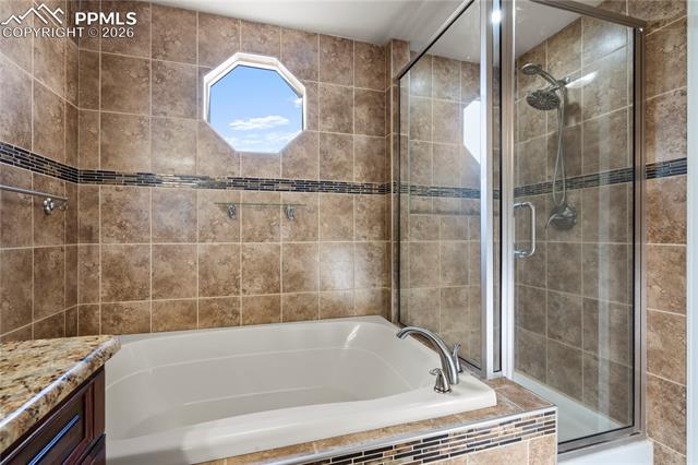 7672 Bullet Road Peyton, CO 80831 - Photo 26 of 49 Primary Bathroom