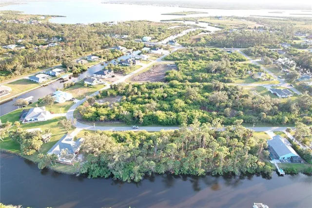 an aerial view of lake and residential houses