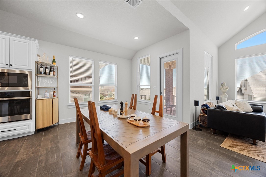 109 High Plains Drive Georgetown, TX 78628 - Photo 11 of 43 a view of a dining room with furniture and a window