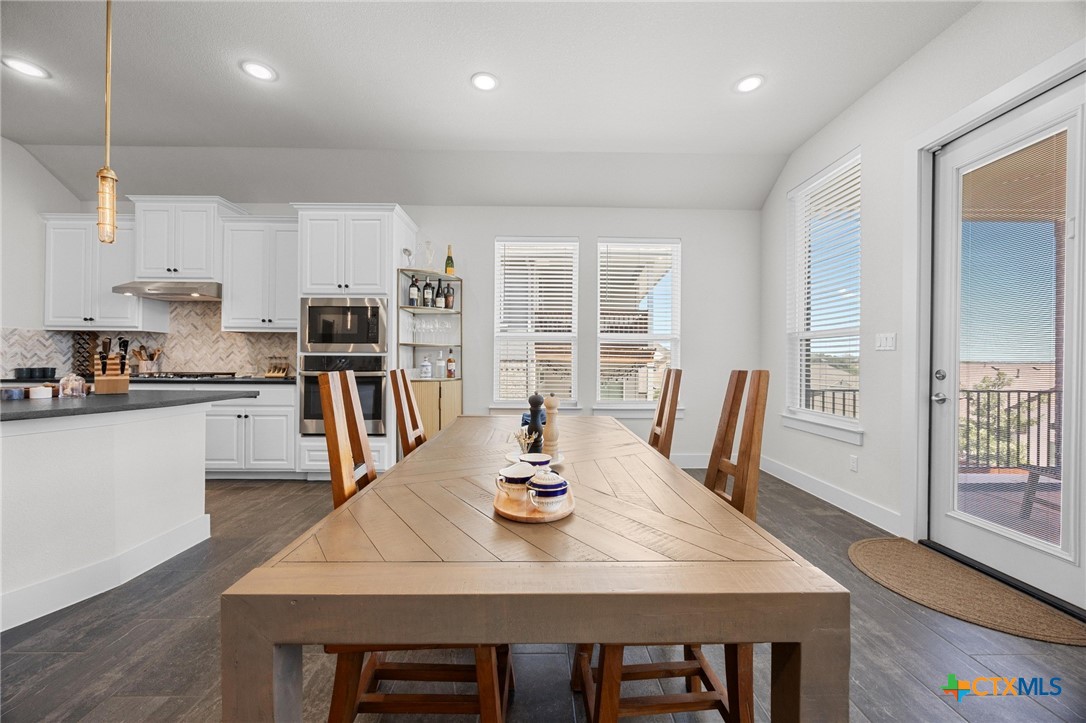 109 High Plains Drive Georgetown, TX 78628 - Photo 12 of 43 a view of a dining room with furniture and wooden floor