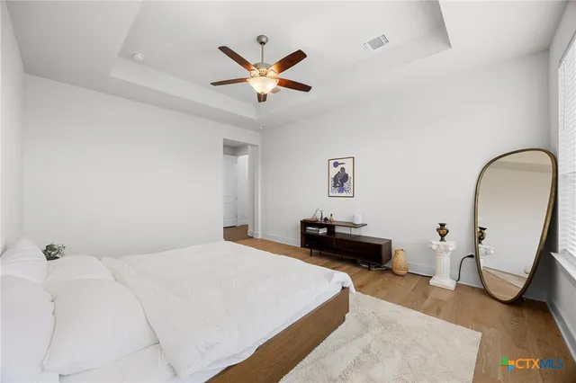 a bathroom with a sink a mirror and shower