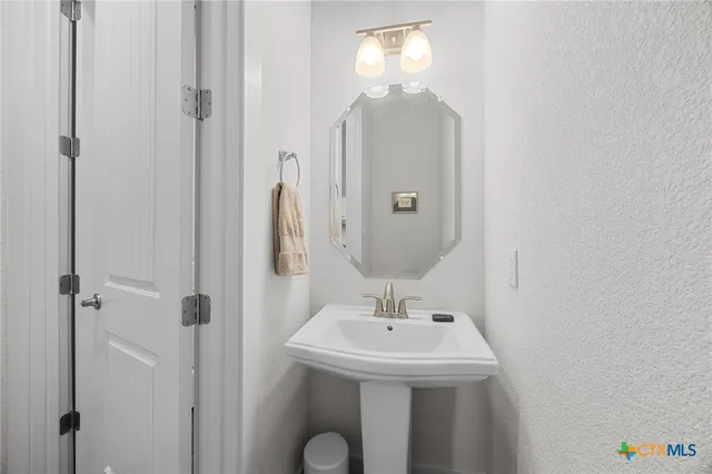 a bathroom with a granite countertop sink a toilet and bathtub