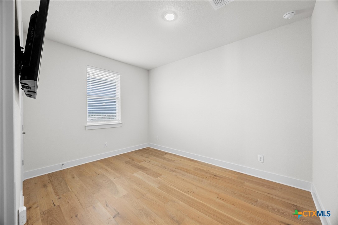 109 High Plains Drive Georgetown, TX 78628 - Photo 29 of 43 an empty room with windows