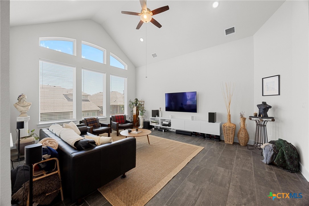 109 High Plains Drive Georgetown, TX 78628 - Photo 4 of 43 a living room with furniture and a flat screen tv