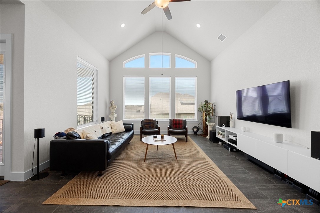 109 High Plains Drive Georgetown, TX 78628 - Photo 5 of 43 a living room with furniture flat screen tv and a large window