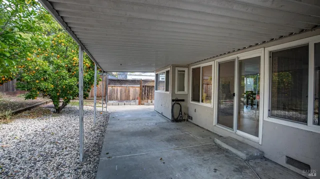 a view of a house with a backyard and porch