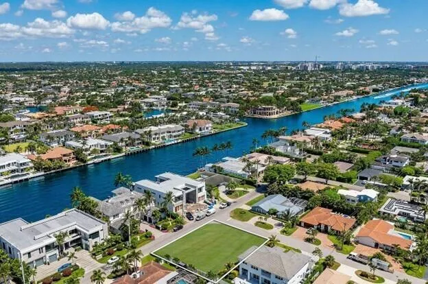 an aerial view of residential houses with outdoor space