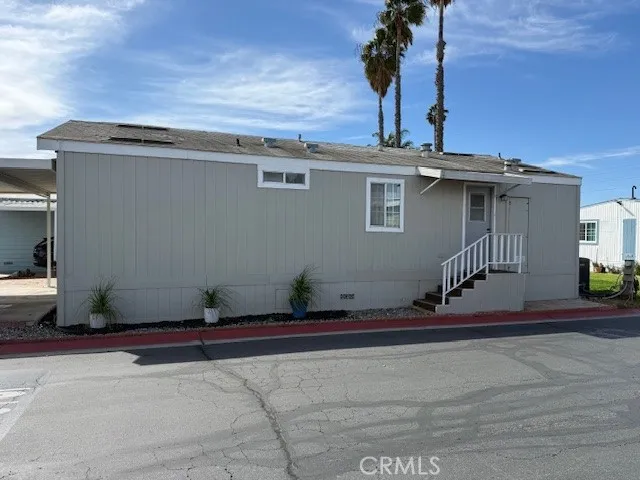 1855 East Riverside Drive, Unit 273 Ontario, CA 91761 - Photo 1 of 9 a view of a house with a roof