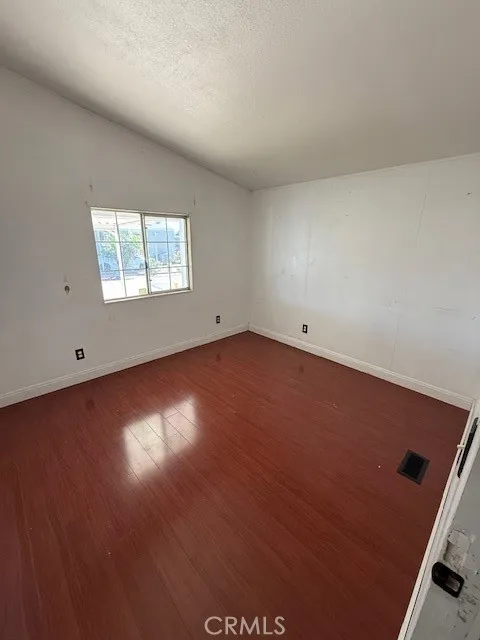 1855 East Riverside Drive, Unit 273 Ontario, CA 91761 - Photo 5 of 9 an empty room with a window
