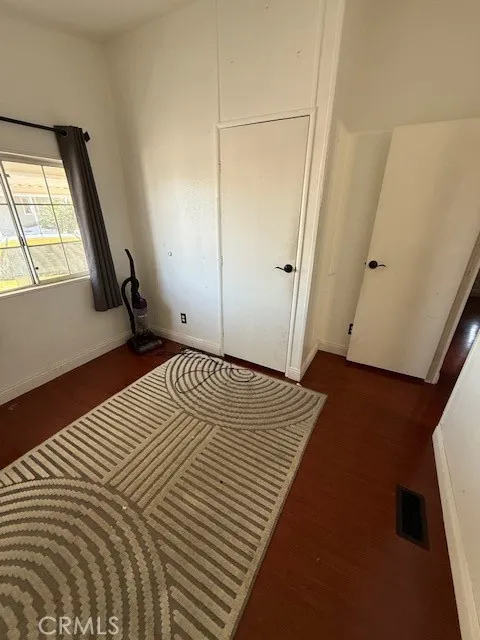 1855 East Riverside Drive, Unit 273 Ontario, CA 91761 - Photo 6 of 9 a view of a room with wooden floor and bench