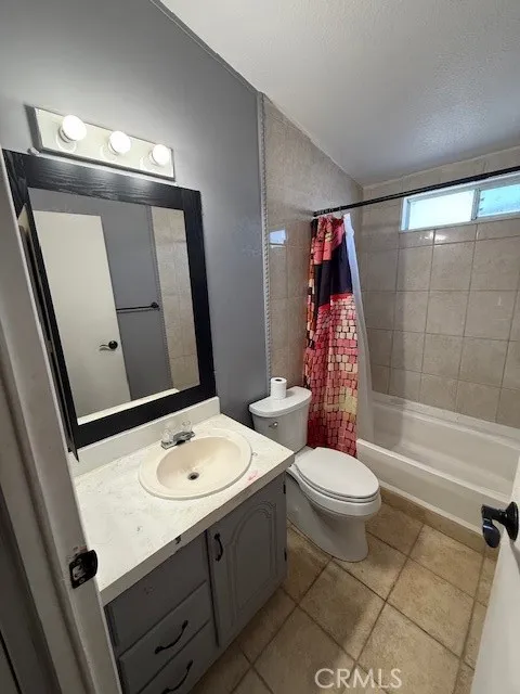 1855 East Riverside Drive, Unit 273 Ontario, CA 91761 - Photo 7 of 9 a bathroom with a sink a toilet and shower