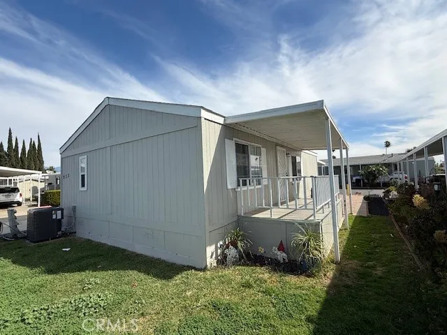 1855 East Riverside Drive, Unit 273 Ontario, CA 91761 - Photo 8 of 9 a backyard of a house with yard and outdoor seating