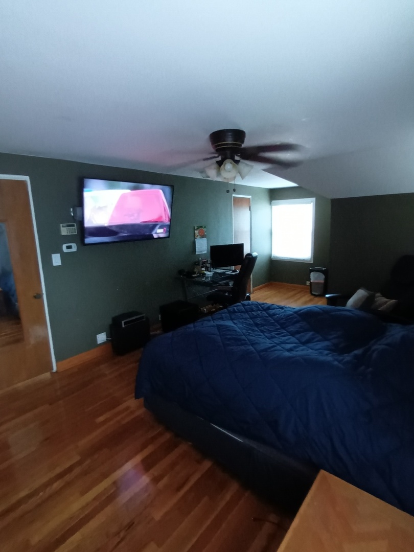8742 East Prairie Road Skokie, IL 60076 - Photo 17 of 29 a living room with furniture and a flat screen tv