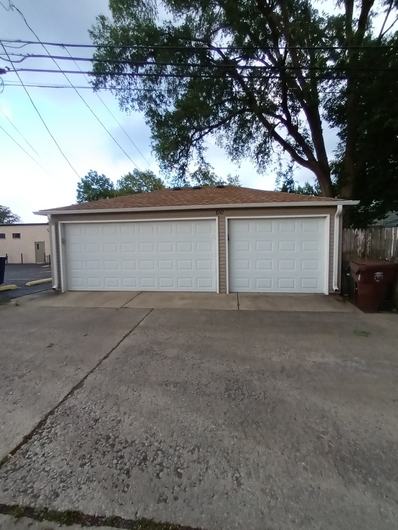 8742 East Prairie Road Skokie, IL 60076 - Photo 29 of 29 a view of garage and yard