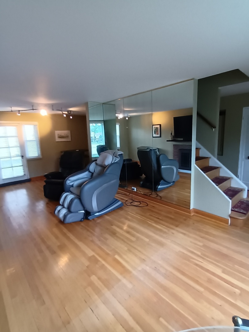 8742 East Prairie Road Skokie, IL 60076 - Photo 5 of 29 a living room with furniture and a flat screen tv