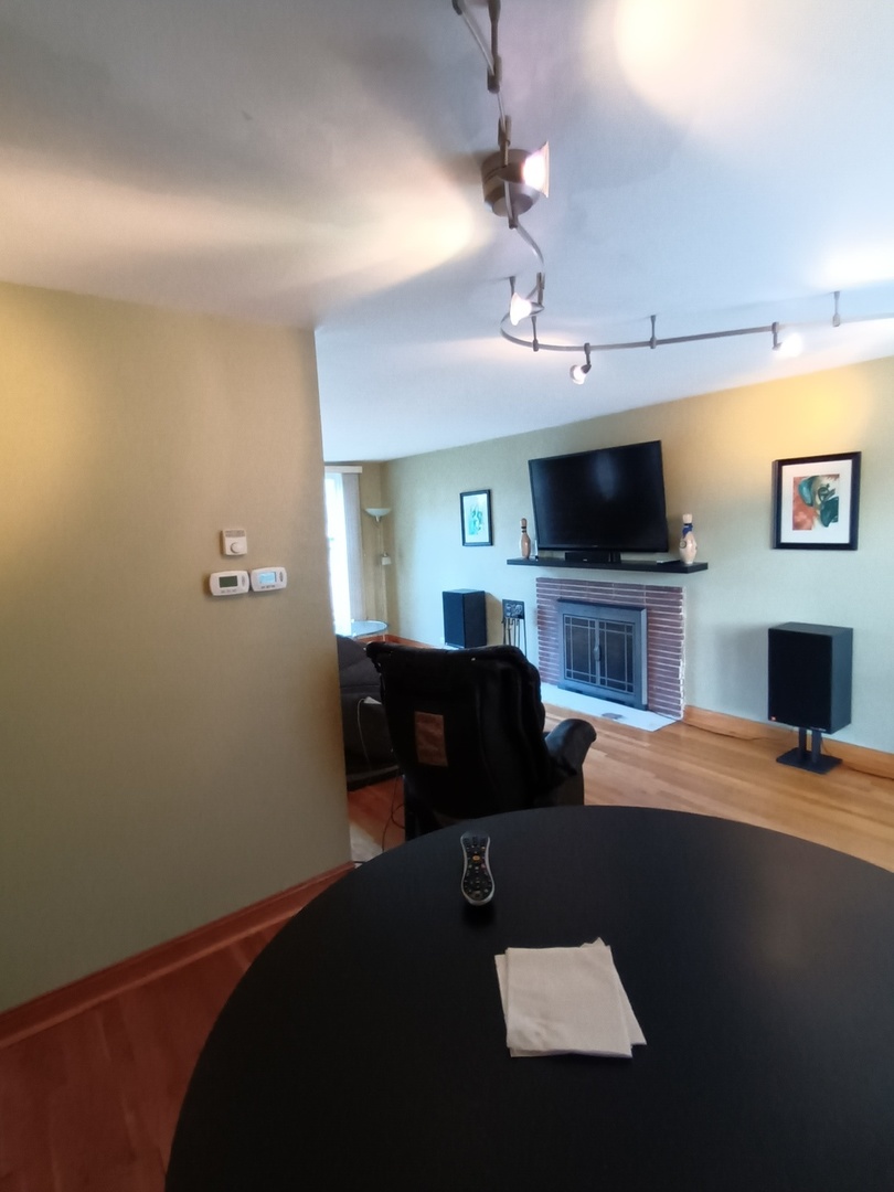 8742 East Prairie Road Skokie, IL 60076 - Photo 7 of 29 a living room with furniture and a flat screen tv