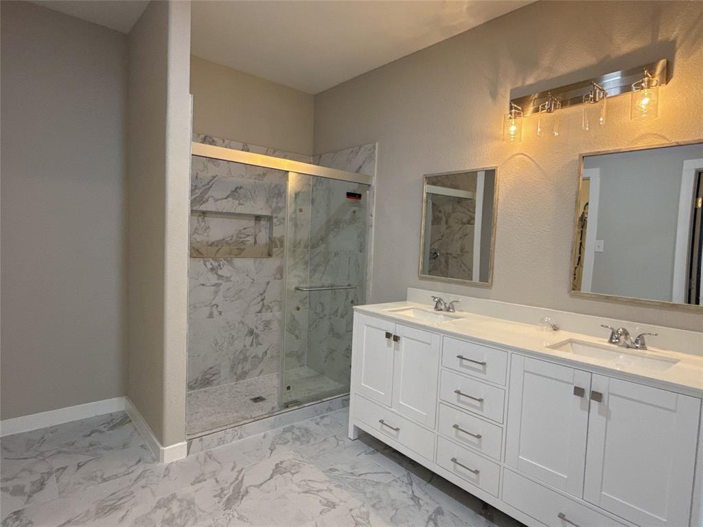 1913 Pin Oak Trail Anna, TX 75409 - Photo 10 of 17 a bathroom with a shower sink and mirror