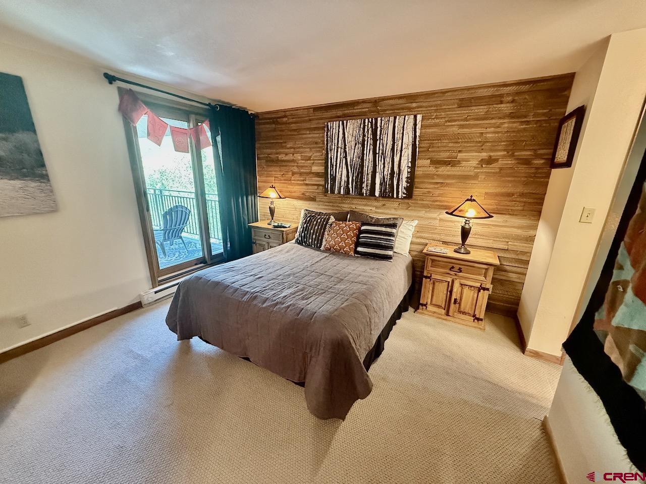 11 Snowmass Road, Unit 337 Crested Butte, CO 81225 - Photo 22 of 35 a bedroom with a large bed and a window