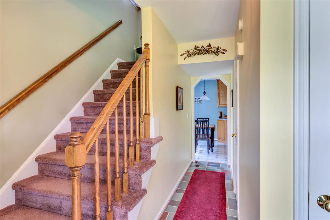 74 Spring Oaks Lane Ruckersville, VA 22968 - Photo 7 of 28 a view of a hallway with wooden floor and entryway
