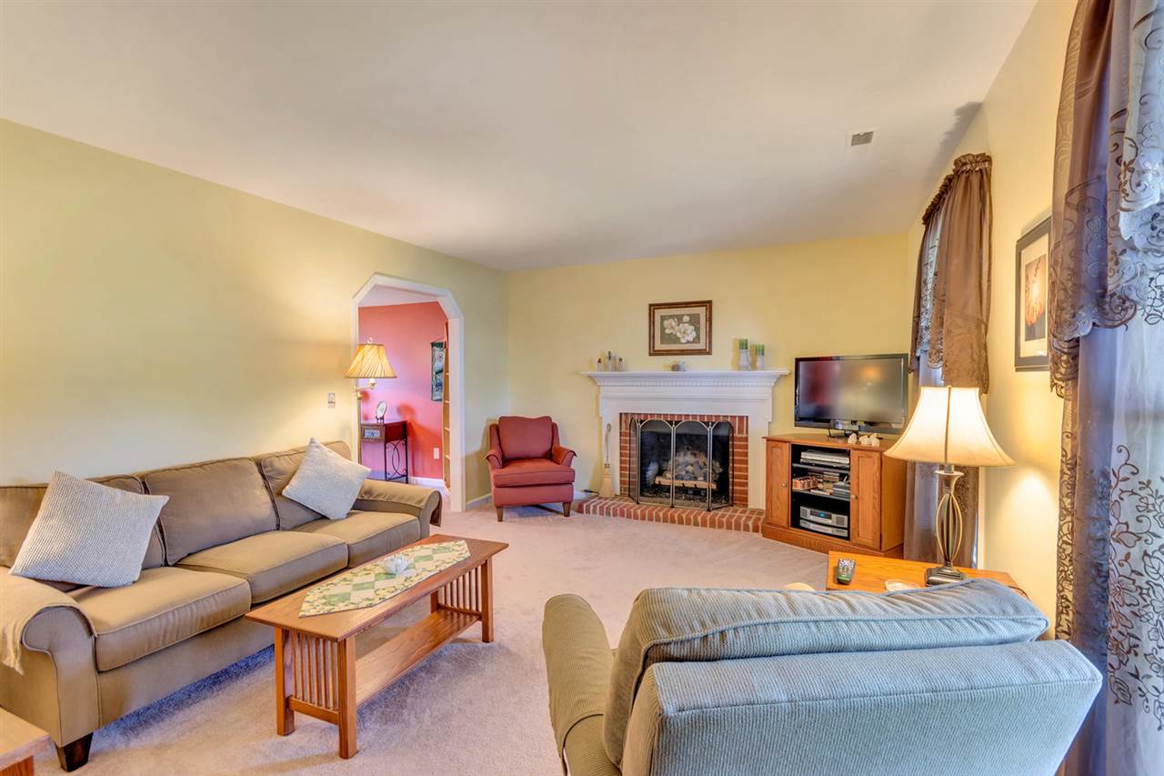 74 Spring Oaks Lane Ruckersville, VA 22968 - Photo 8 of 28 a living room with furniture and a fireplace